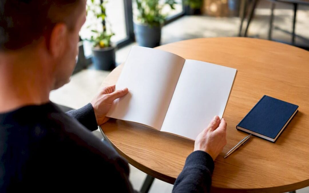 Hands reviewing life insurance booklet
