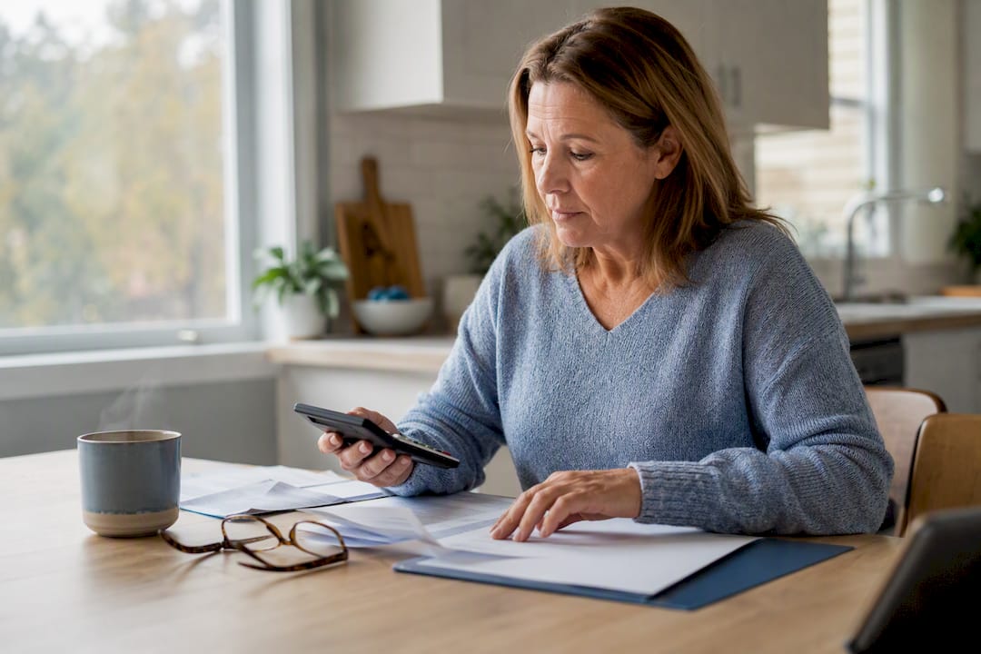 1787625442286 Hands Organizing Retirement Financial Papers