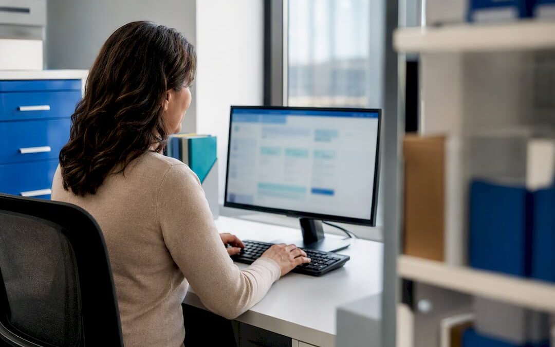Payroll administrator entering taxable benefit information