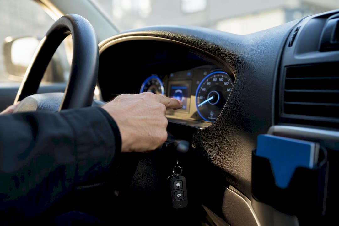 Employee checking vehicle mileage for payroll records
