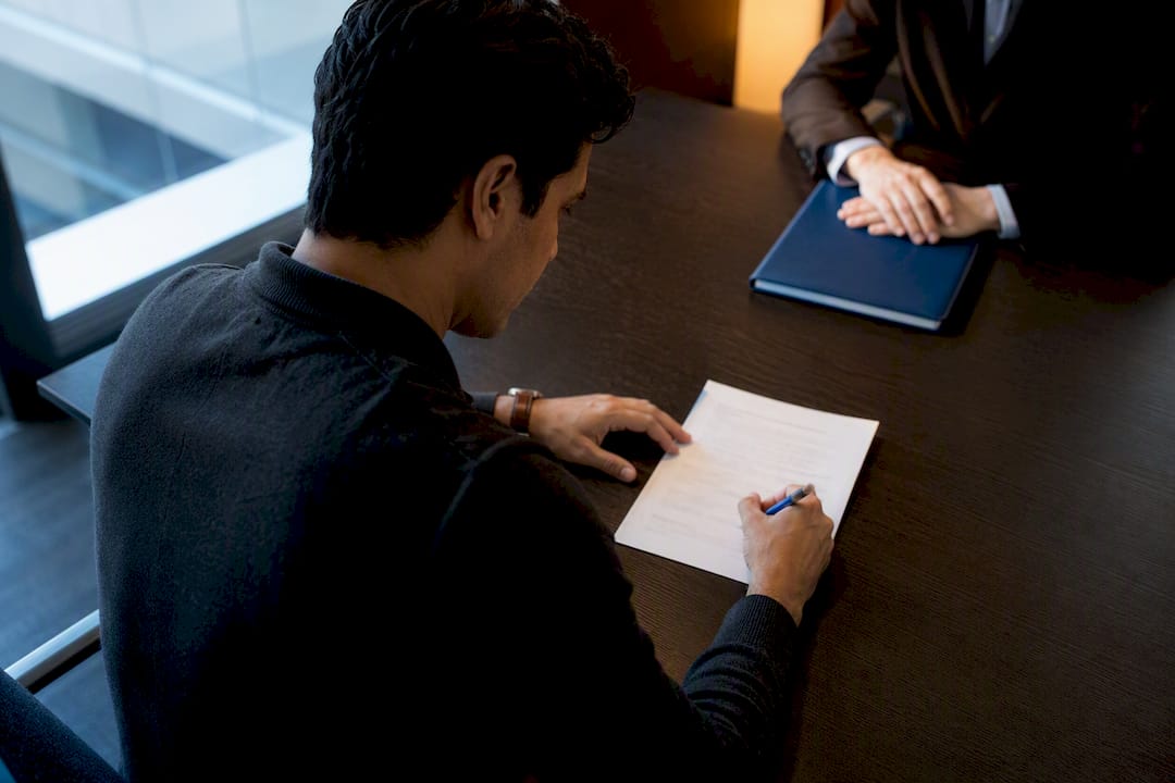 1788921956874 Person Signing A Power Of Attorney Document