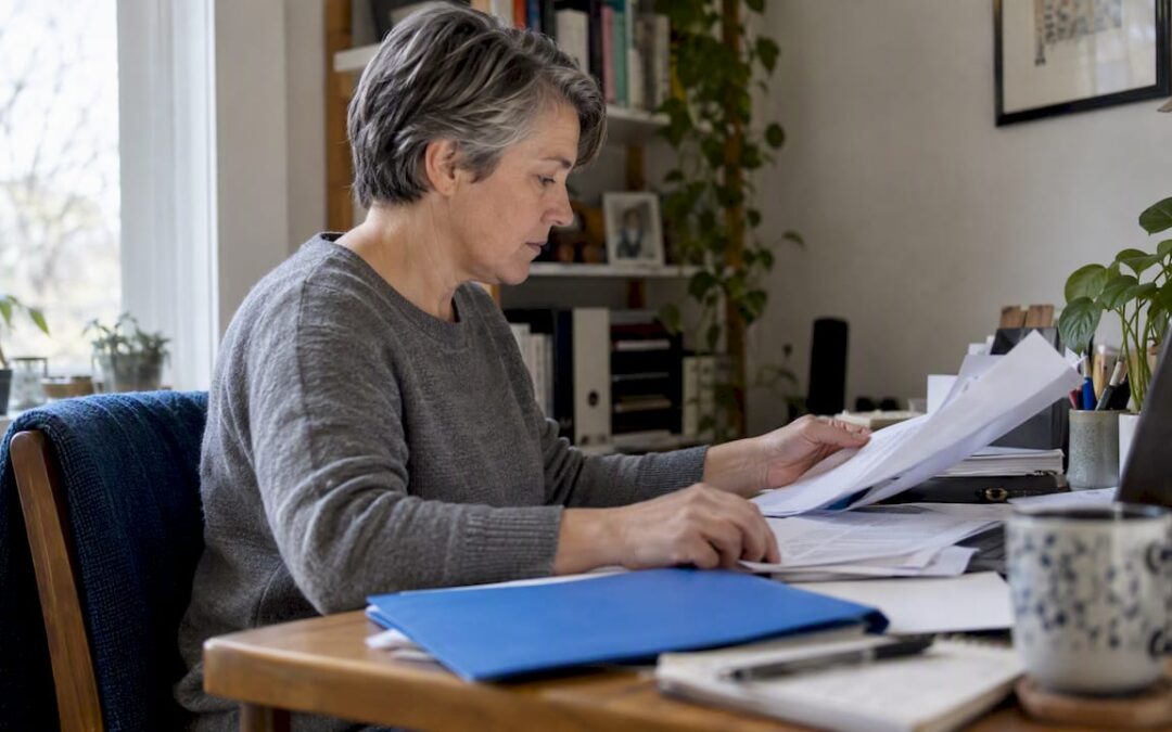 Beneficiary organizing life insurance claim paperwork