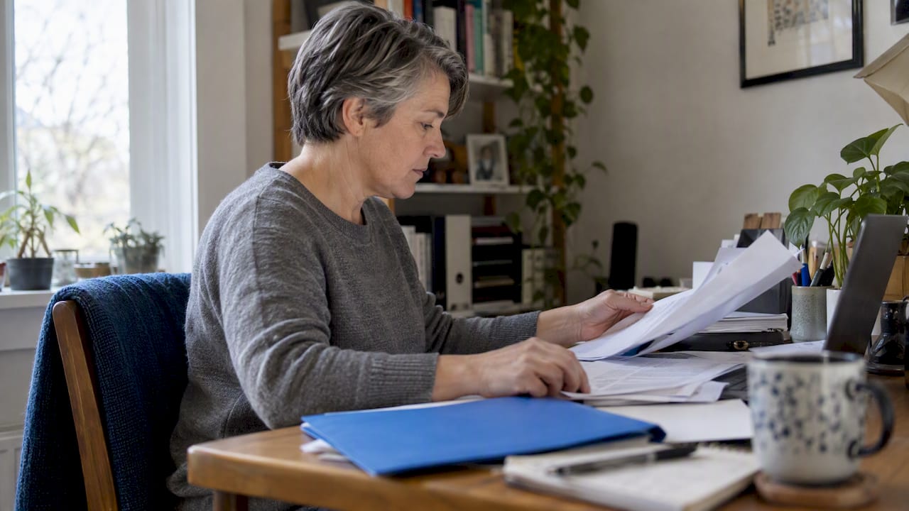 1791538567417 Beneficiary Organizing Life Insurance Claim Paperwork